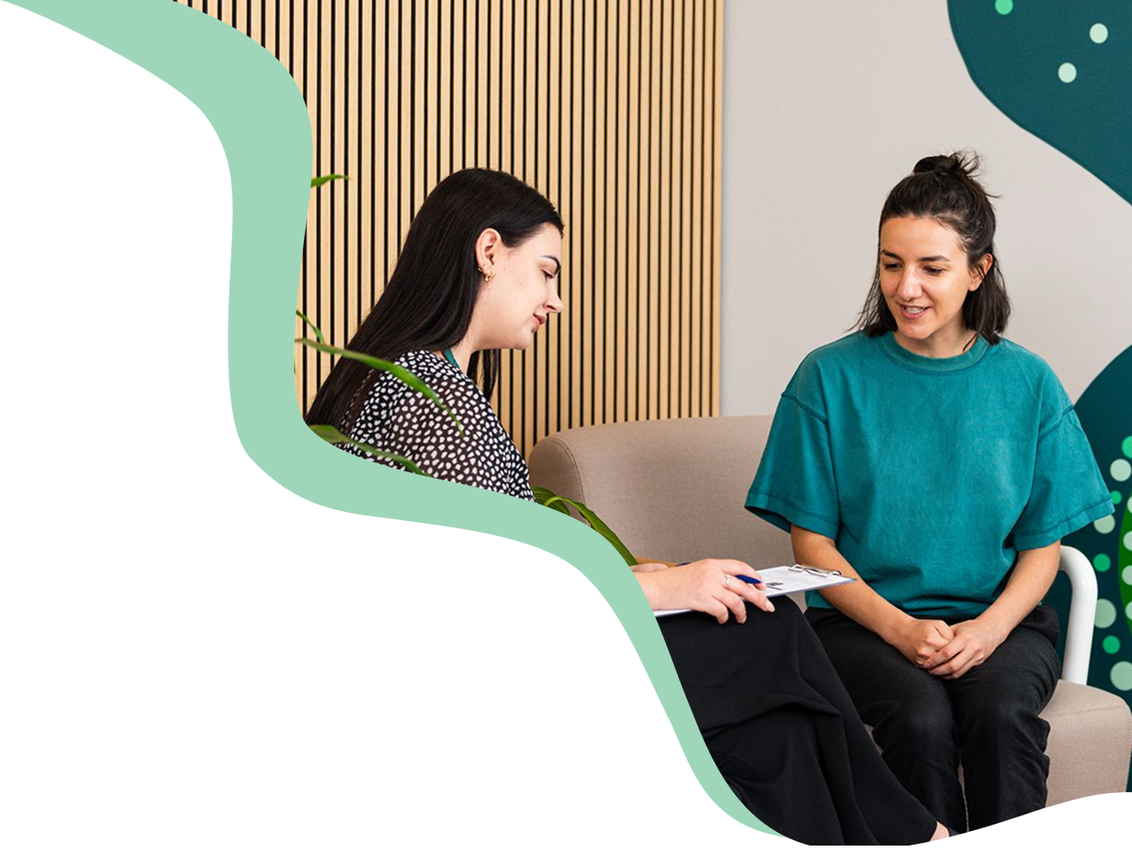 Two woman sitting and having a discussion 